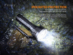 Fenix flashlight with water resistance feature on a rocky surface