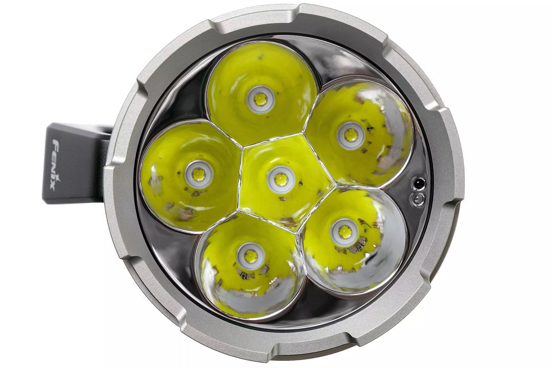 Circular light fixture with yellow lenses on a white background