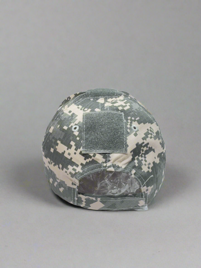 Camouflage helmet with a patch on a white surface