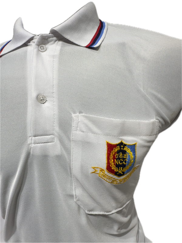White shirt with a embroidered emblem on the chest against a white background