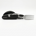 A black and silver multi-tool pocket knife with a built-in stainless steel fork, shown on a clean white background. The brand name 'TRAVELER' is clearly visible on the textured black handle.
