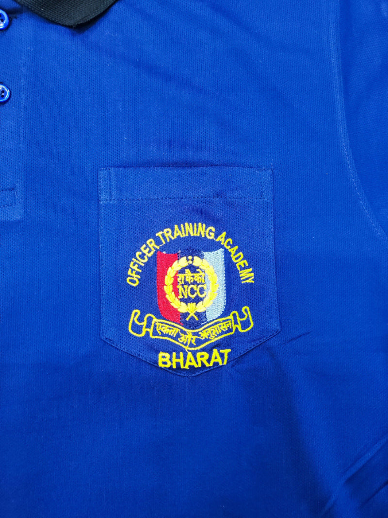 Blue polo shirt with a embroidered patch on the chest